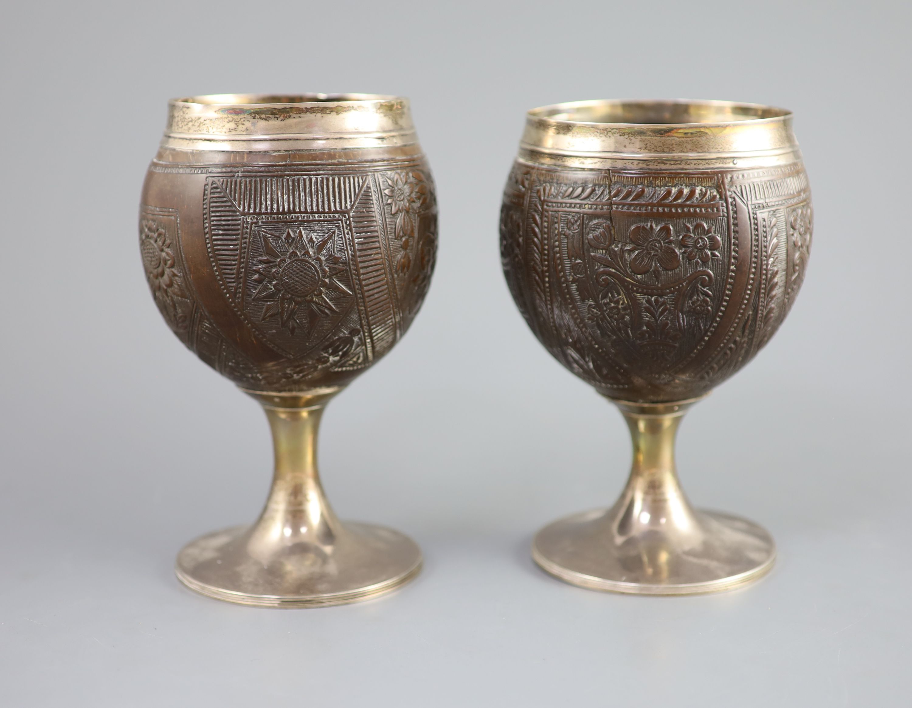 A pair of George III silver mounted coconut cups by Phipps & Robinson